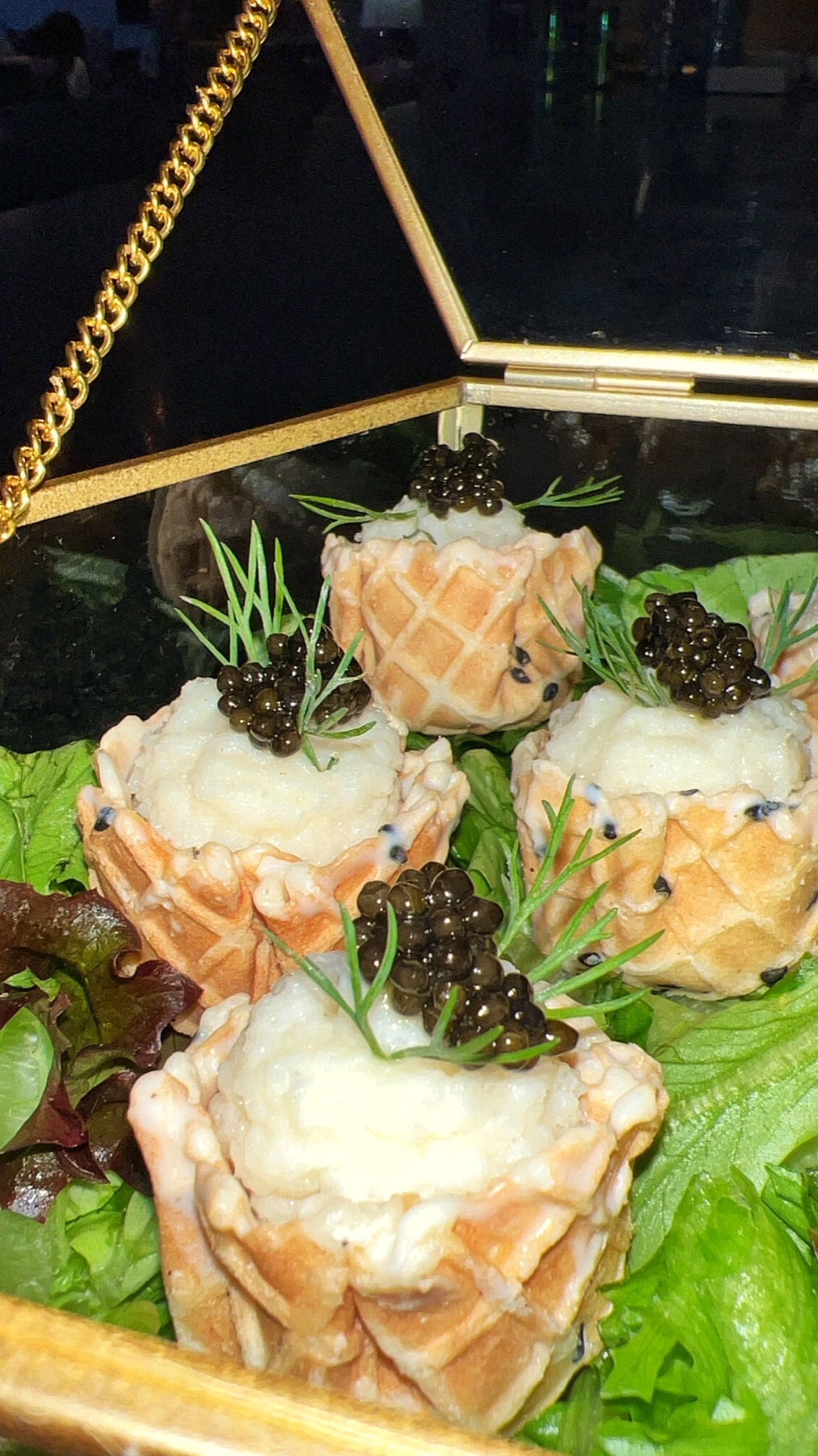 Caviar-topped appetizers in crisp cups