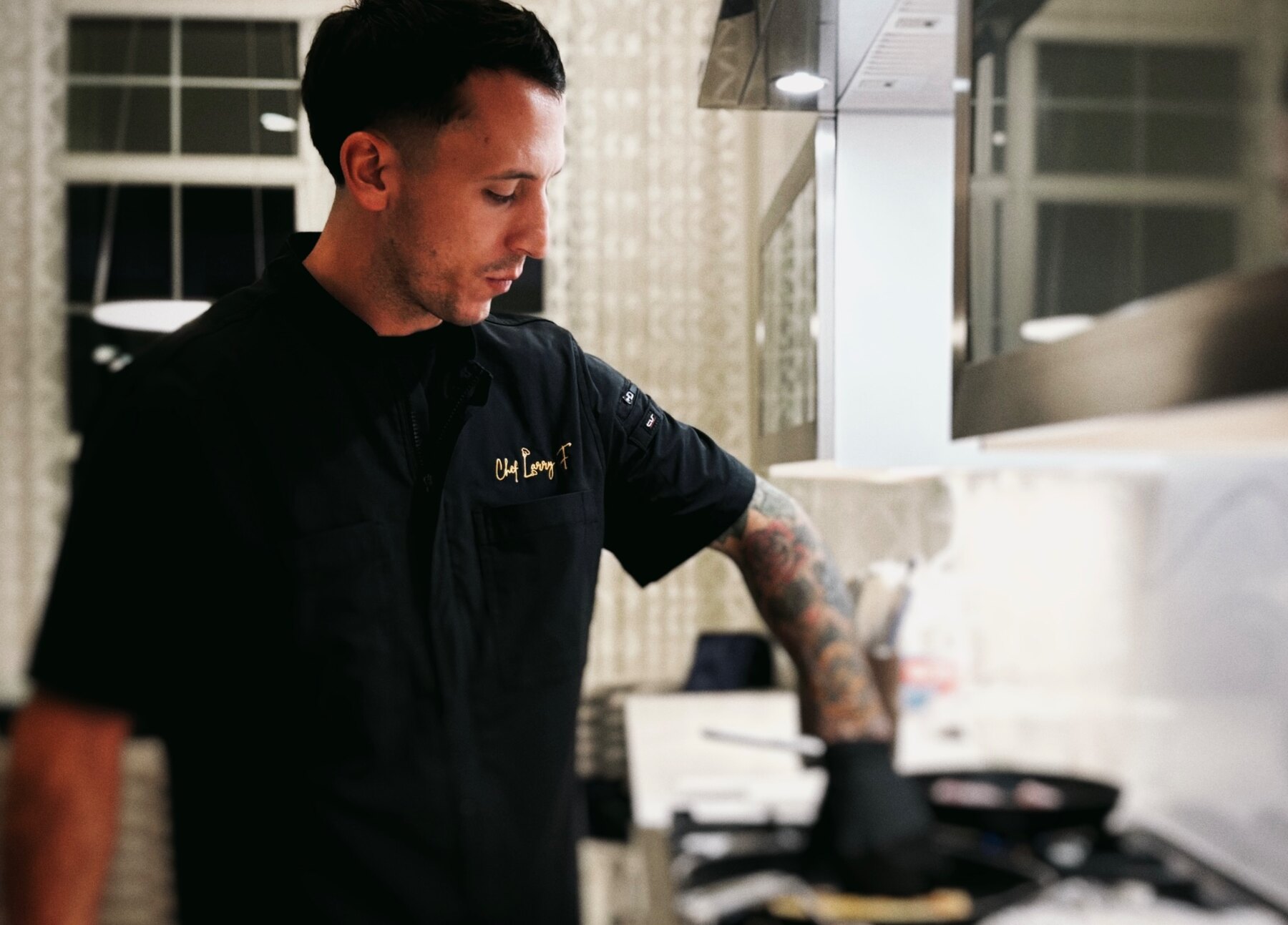 Chef Larry Falisi preparing dinner in a private home